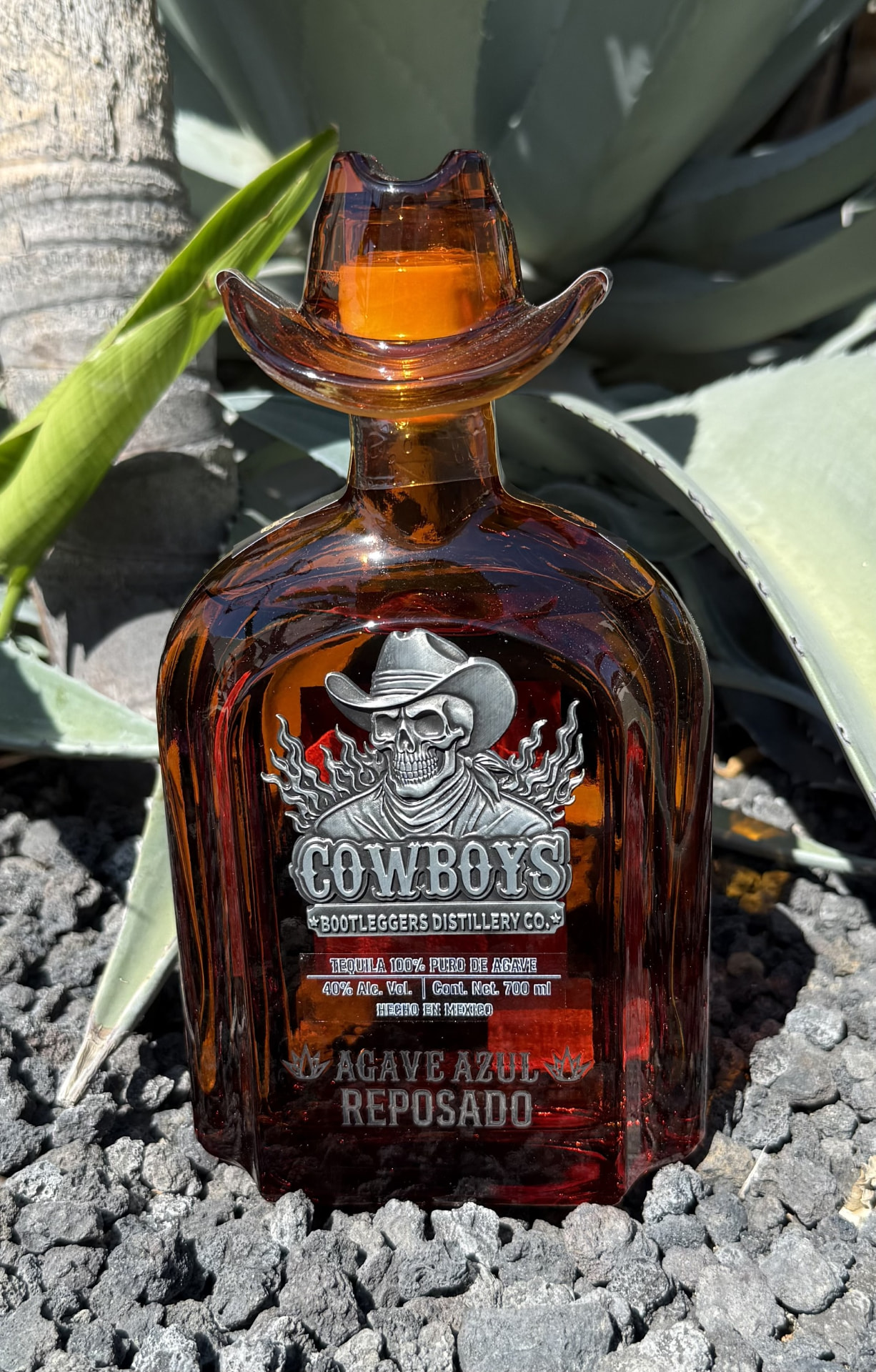 Amber Cowboys Bootleggers Distillery Co. bottle with cowboy-hat stopper — Agave Azul Reposado
